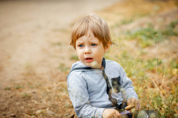 istock Happy child playing in the sun. Freedom concept. 1473214897