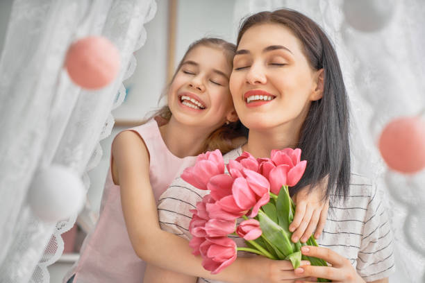 istock daughter is congratulating mom 1473214960