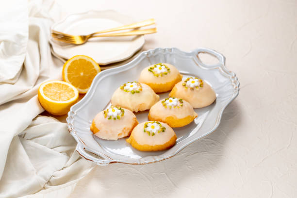 istock Lemon shaped citrus flavored cake coated with white chocolate and pistachio 1473215741