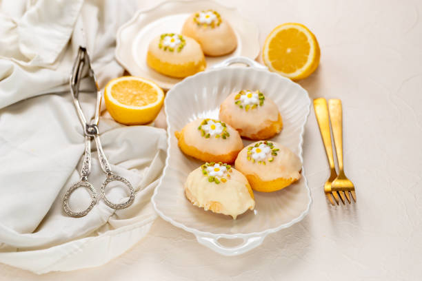 istock Lemon shaped citrus flavored cake coated with white chocolate and pistachio 1473215748
