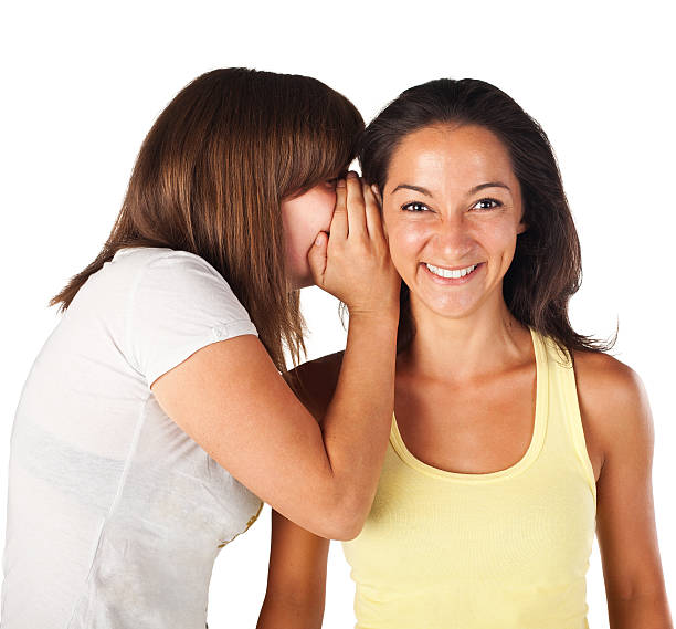 istock Best friends whispers one to each other 147321625