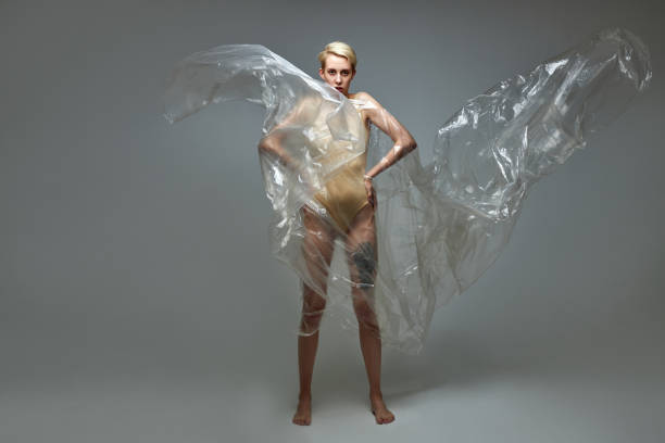 istock weak tired slim model woman with plastic bag on body 1473217073