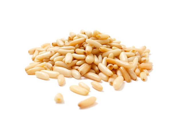 A large group of pine nuts in a pile Pine nuts pinion stock pictures, royalty-free photos & images