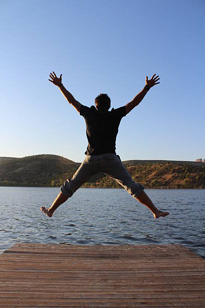 istock jump near the lake 147322308
