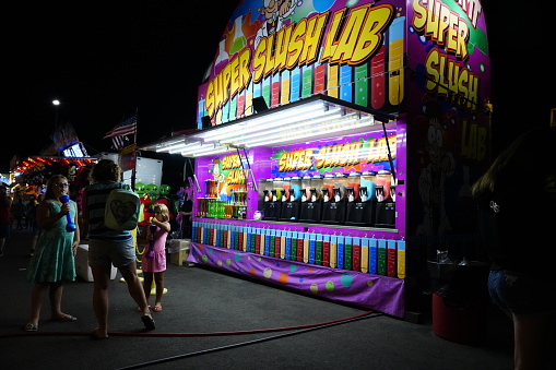 Fond du Lac, Wisconsin / USA - July 21st, 2019: Families from the community came out  during the night to play carnival games at the local county fair.