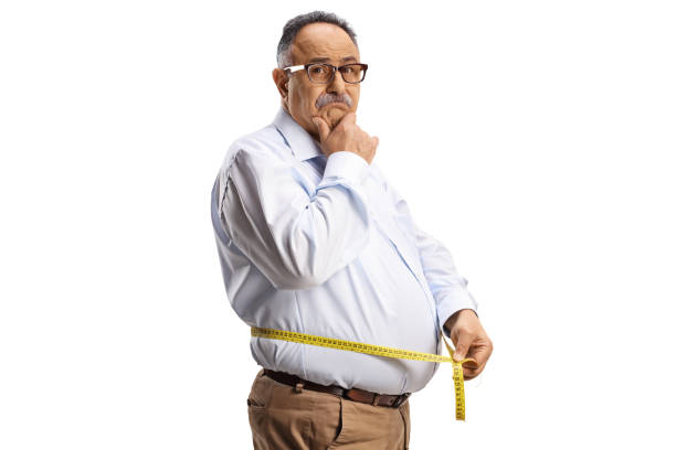 istock Sad mature man measuring waist 1473224571