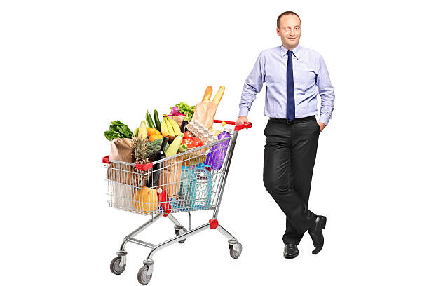 istock Man posing next to a full shopping cart 147322625