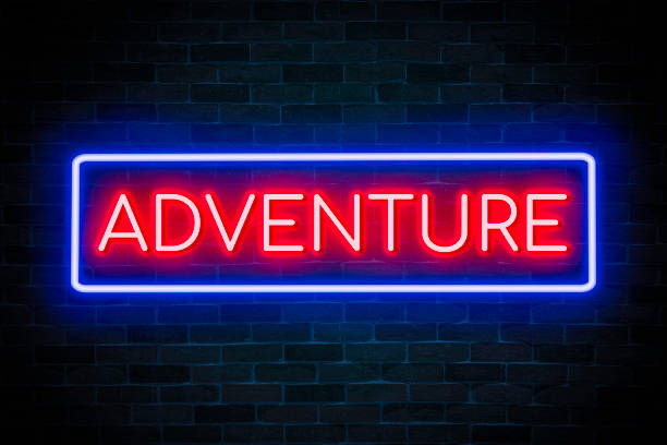 istock Adventure text neon banner on brick wall background. 1473227675