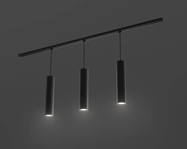 istock Pendant ceiling long tube lamps 3d render. Modern interior light for home or office isolated on dark background. Hanging chandelier with black metal cylindrical lampshade at night 1473228337