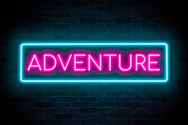istock Adventure text neon banner on brick wall background. 1473230459