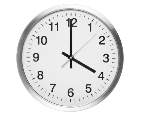 Round clock with black and red pointers isolated on white