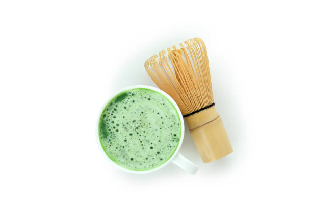 istock Cup of matcha latte and chasen isolated on white background 1473232319
