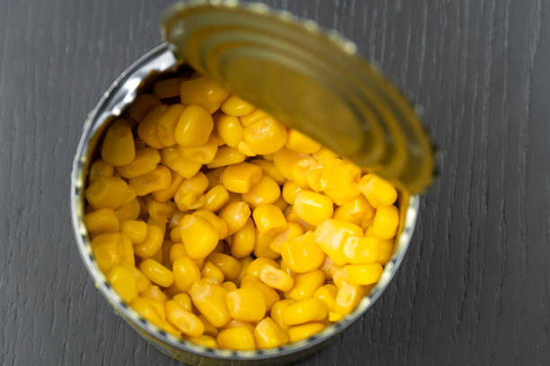 istock Close-up view from above of corn in a tin can on a dark table 1473232589