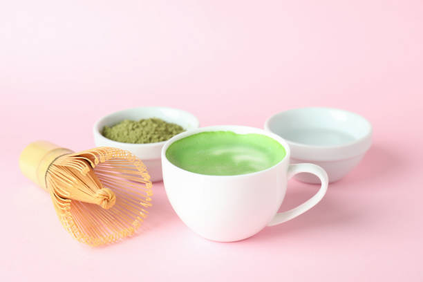 istock Matcha latte and accessories for making on pink background 1473233668