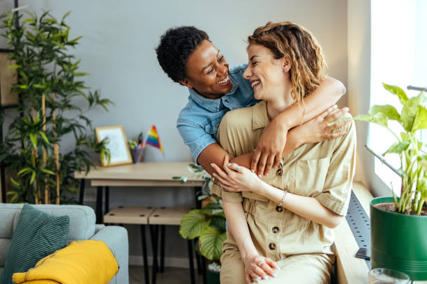 Couple embracing at home stock photo