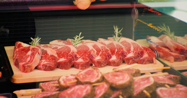 istock Raw marbled beef steaks in show case and ready for frying. 1473235171