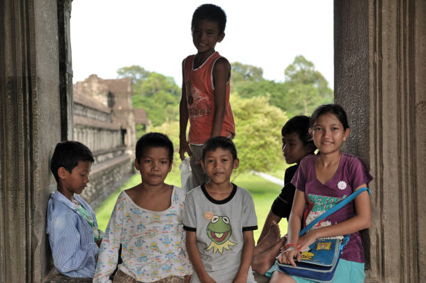 A group of local children play in Angkor wat temple on August 12, 2011 in Siem Reap, Cambodia