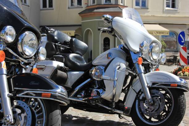 Harley Davidson Bad Toelz, Germany -  August 14, 2011: Harley Davidson motorcycles are lined up on a sunny afternoon in Bad TAlz, Upper Bavaria. Harley is America harley davidson fat boy stock pictures, royalty-free photos & images