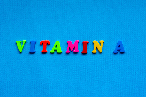 Vitamin Lettering Text Vitamin A From Plastic Colored Letters On Blue Paper Background ...