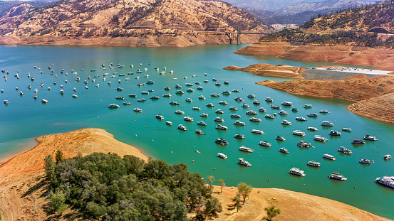 Aerial view of Bidwell Canyon Marina on Lake Oroville with bridge in background, Oroville, California, USA.
