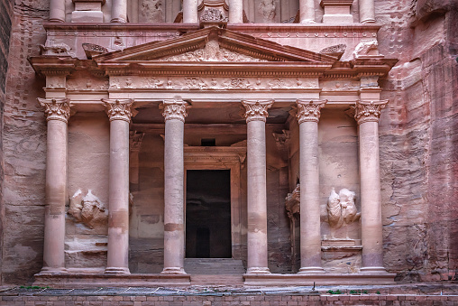 Old ruins of Al Khazneh treasury entrance in Petra. Jordan
