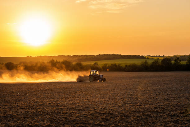 istock Tractor preparing farmland with seedbed for the next year 1473238897