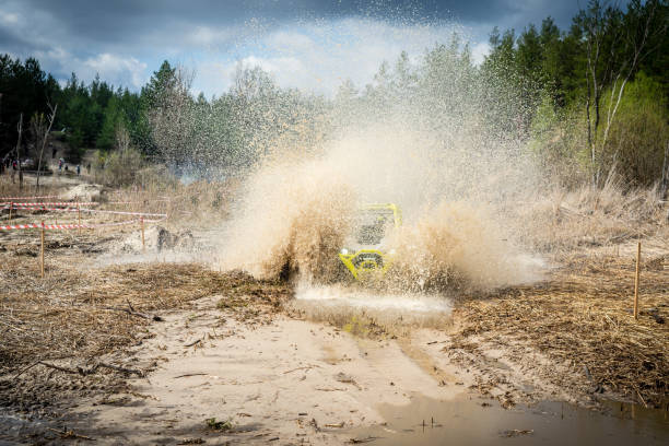 istock Cool view on hard ride UTV in muddy water 1473243322