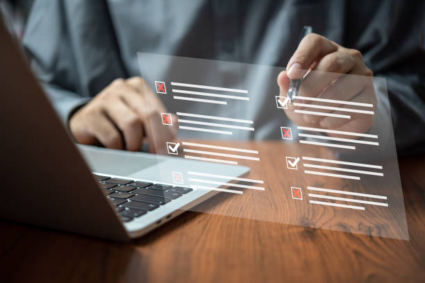 istock man chooses questionnaire with checkbox, survey form online, answer questions in the exam of test business checklist and filling survey form online using technology for education, learning. 1473244171