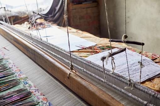 Threads of tradition - an Indian loom standing proudly in a workshop in Kashmir, weaving together the rich cultural heritage and artistic expression of the region's master weavers