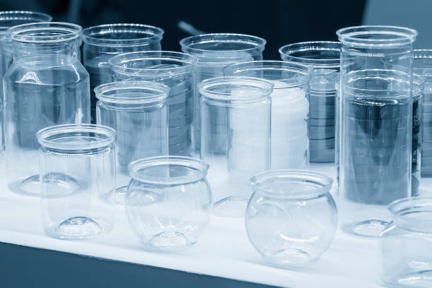 istock Closeup the group of jars glassware in the light blue scene. 1473247196