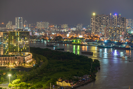 Ho Chi Minh, Vietnam - April 29, 2022: Aerial Ho Chi Minh City at night, Bach Dang wharf park, Bach Dang wharf, Nha Rong Wharf in District 1. Selective focus