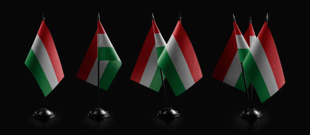 istock Small national flags of the Hungary on a black background 1473254683