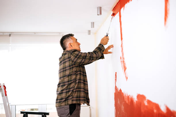 istock Man painting his apartment 1473254843