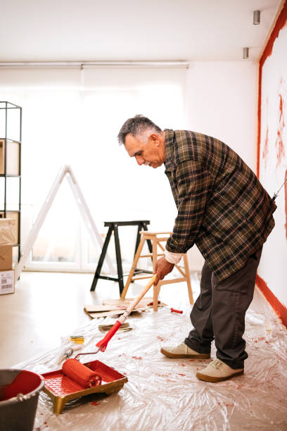 istock Man painting his apartment 1473255588