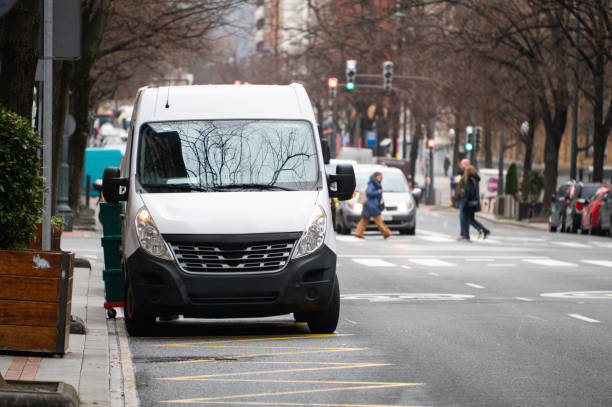 Delivery van stationary in a street side