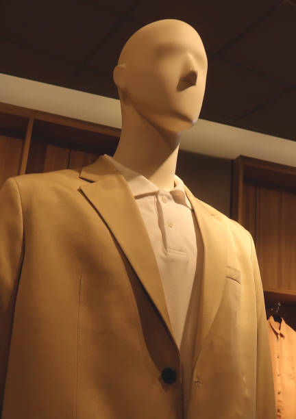 istock Mannequin in a coat in boutique 1473259590
