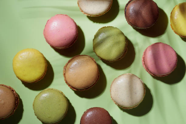 istock Colorful pastel eco handmade macaroons on green background with a shadow. Gift for 8 March, International Women's Day, Valentine Day 1473262860