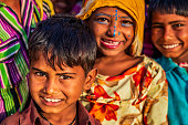 istock Group of happy Gypsy Indian children, desert village, India 1473266065