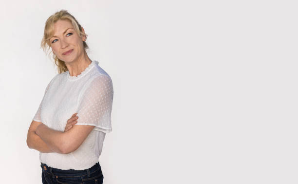 istock Attractive Smiling Middle Aged Woman Studio Portrait on White Background 1473267671