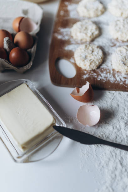 istock Cooking at home, messy table, ingredients: dairy products, eggs, sugar and butter 1473274491