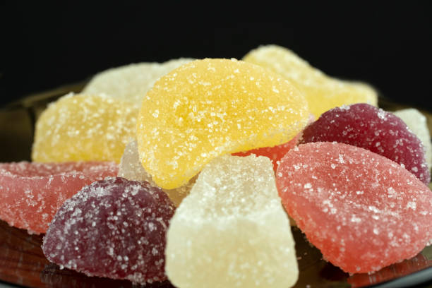 istock Multi-colored, marmalade candies, close-up, isolated on a black background. 1473280584