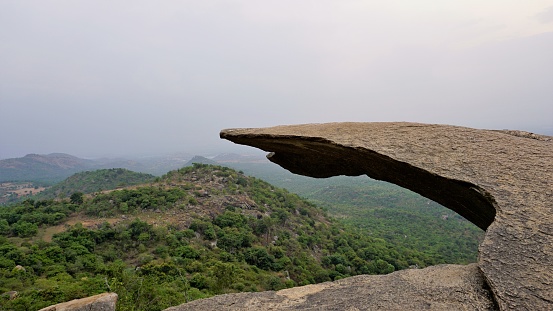 Hanging Rock of Avalabetta peak located in Chikaballapur, Karnataka. Picturesque Place to Trek in Serenity.