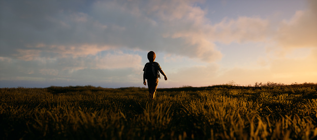 Little boy walks through tall grass in countryside under a blue cloudy sky during sunset. 3D rendering.