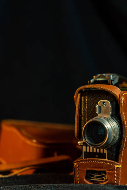 istock Vintage film camera with black background 1473284073