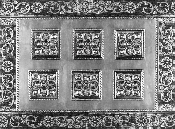 istock ancient Pattern of silver metal plate with flower carved background 1473285033