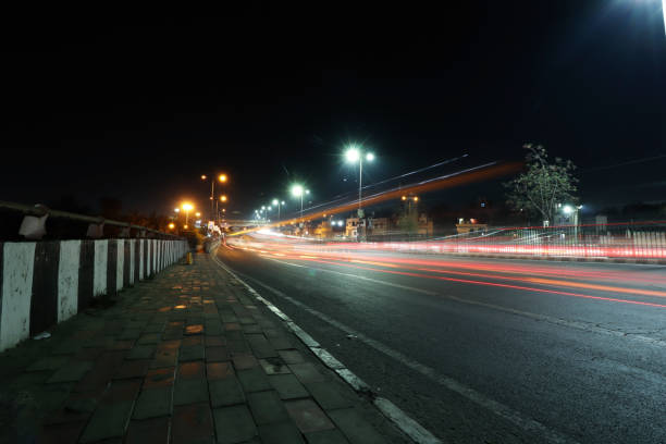 istock Car light travelling at night 1473287037