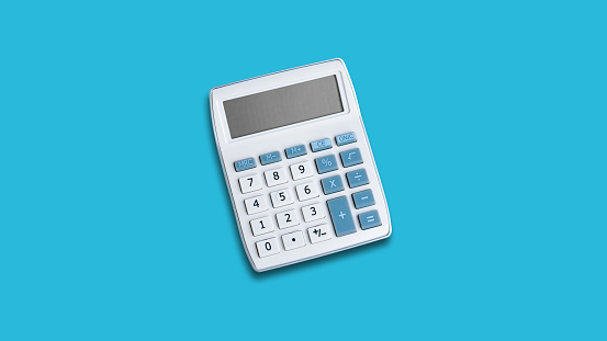 Calculator on a blue background with copy space on the left and right for counting and planning