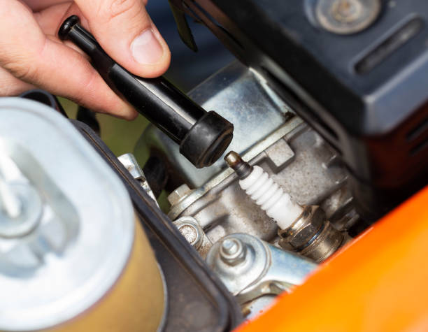 istock Replacing the spark plug in the motor block engine cylinder. Maintenance of the ignition system. Close-up 1473290833
