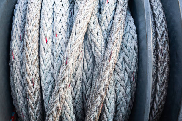istock Marine ship winch for mooring operations with a rope wound around it, close-up. 1473291736