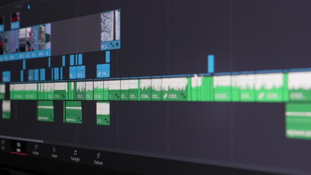 Movie editor selects, selects, and moves footage in timeline editing project